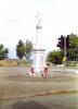 Statue on tapering plinth.