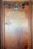 Wood panel with name.