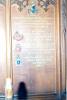 Wooden board with list of names.