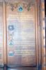 Wooden board with list of names.