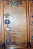 Wooden board with list of names.