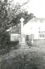 Cross and buildings in the background.