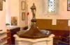 Font with metal cover and figure.