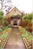 Stone chapel with path leading up to it.