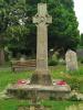 Short armed wheel cross over a plinth