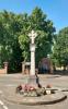 Memorial standing on a circular island at a road junction.