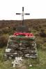 Cross and plaque atop stone pedestal