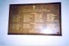 Wooden board with columns of names.