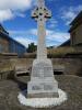 Celtic cross with names on its base.
