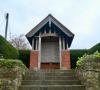 Brick structure with timber roof and memorial panels