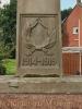 Relief at base of memorial