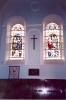 Two stained glass windows with arched tops