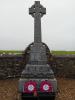 Celtic cross on raised steps, fenced in