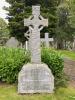 Granite family gravestone topped with a Celtic cross