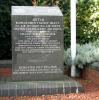Granite stone on a one step base. Top of the stone is at a slight angle inscribed with badges of the 8th USAAF. Inscribed with white lettering.