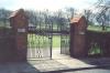 Gates with tablets fixed to brick posts.