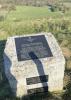 Black plaque on stone mount