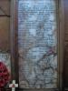 Organ screen with marble tablets inset into limestone backboard. Inscription on the tablets.