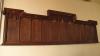 Wooden board with columns of names.