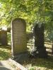 Headstone with black inlaid lettering.