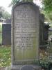 Headstone with inlaid lettering.