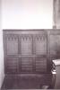 Carved wooden board across altar