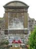 Stone tablet with names carved into it