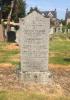 Granite family gravestone with a peon shaped top