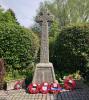 Rough hewn cross with poppy wreaths