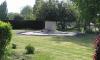 Stone monument in grass field