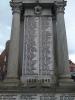 Image of inscribed names on 3 o'clock panel of memorial, panel within two stone columns