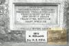 Tablet at base of cross with inscription