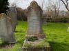 Grave with tall ornate headstone.