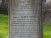 Inscription on headstone. Leaded lettering.