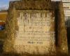Inscription on base of cross