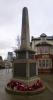 Obelisk on round base with plaques on 2 sides