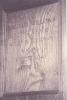 Wooden paneling in hall with inscribed names.