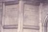 Wooden paneling in hall with inscribed names.