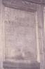 Wooden paneling in hall with inscribed names.
