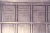 Wooden paneling in hall with inscribed names.