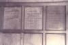 Wooden paneling in hall with inscribed names.