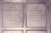 Wooden paneling in hall with inscribed names.