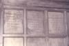 Wooden paneling in hall with inscribed names.