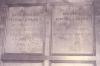 Wooden paneling in hall with inscribed names.