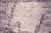 Stoen plaque in wall 