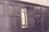 Wooden paneling in hall with inscribed names.