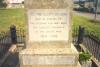 Inscription at base of cross