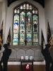 Window and stone memorial plaques in context.