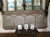 Stone plaques showing main dedication and four columns of names, in context.
