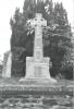 Rough hewn Celtic cross on base with names